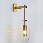 Copper-finish glass wall lamp casting soft light beside a doorway