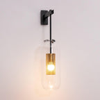 Glass wall lamp with slim arm illuminated against a neutral wall