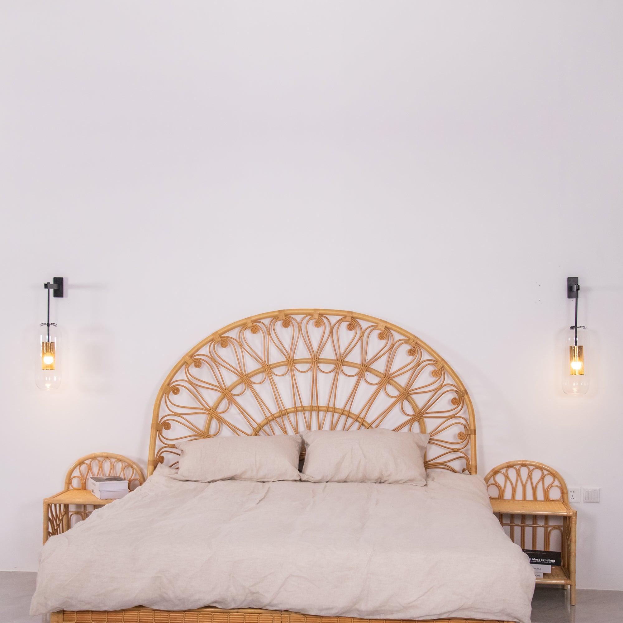 Glass wall lamp with slim arm illuminated in an interior setting