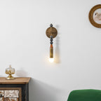 Antique brass and marble wall lamp shown in a styled setting