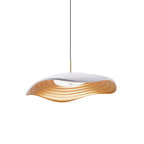 Sleek disc pendant light suspended in a contemporary room