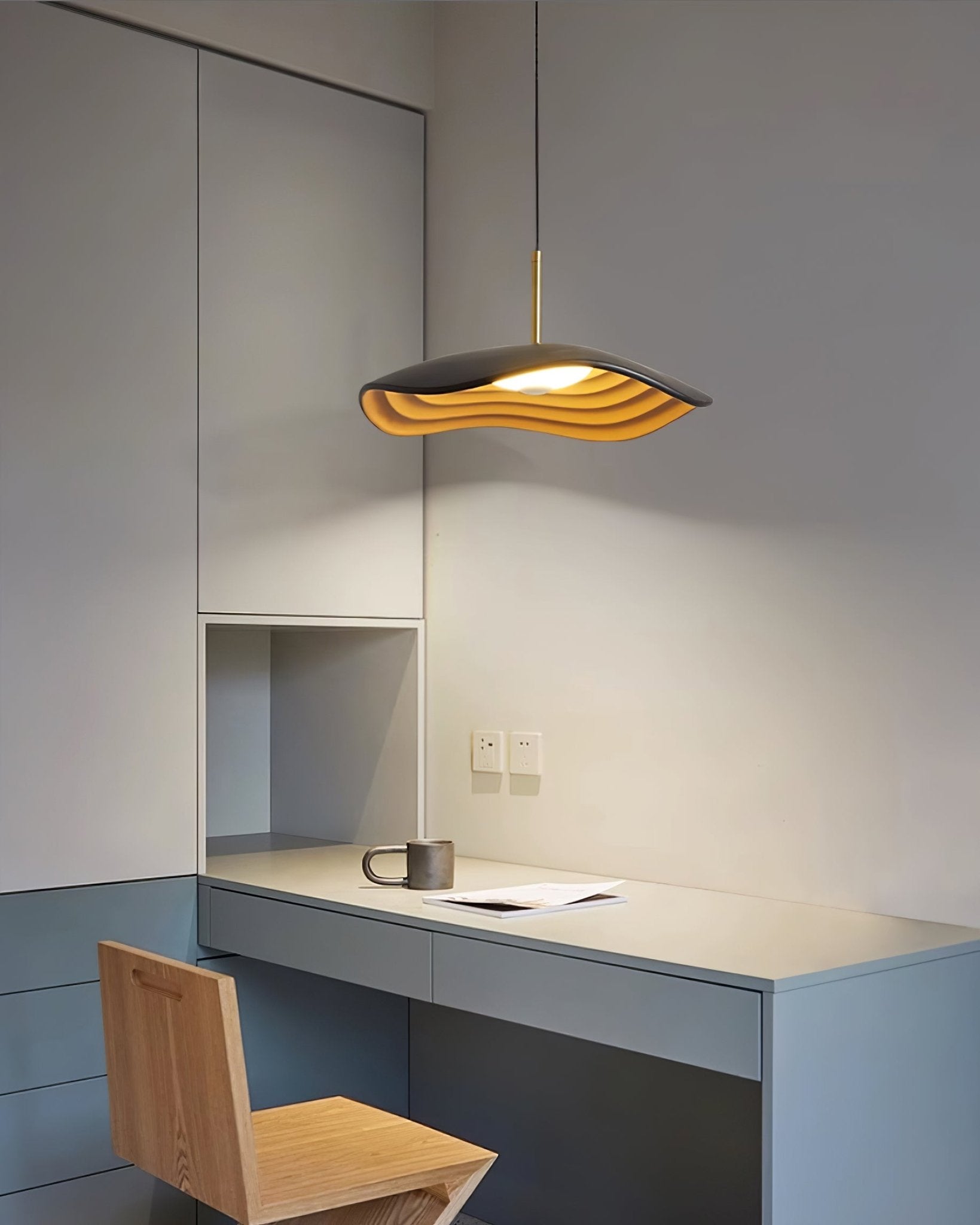 Pendant light glowing warmly in a contemporary kitchen