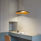 White disc pendant light shown in a bright open space