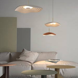 Pendant light casting warm light above a wooden table
