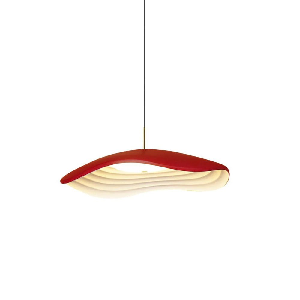 Pendant light with clean disc shade casting soft warm light