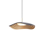 White pendant light hanging in a bright modern interior