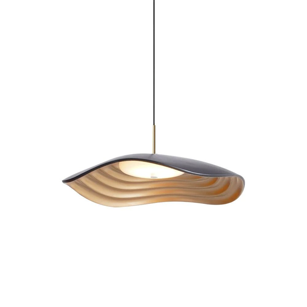 White pendant light hanging in a bright modern interior