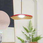 Disc pendant light with slim cord shown close up