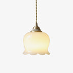 Brass flower pendant light with sculpted shade shown up close