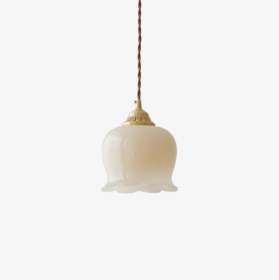 Petal pendant light with brass finish shown against a plain backdrop