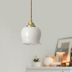 Brass petal pendant light suspended from a slim cord