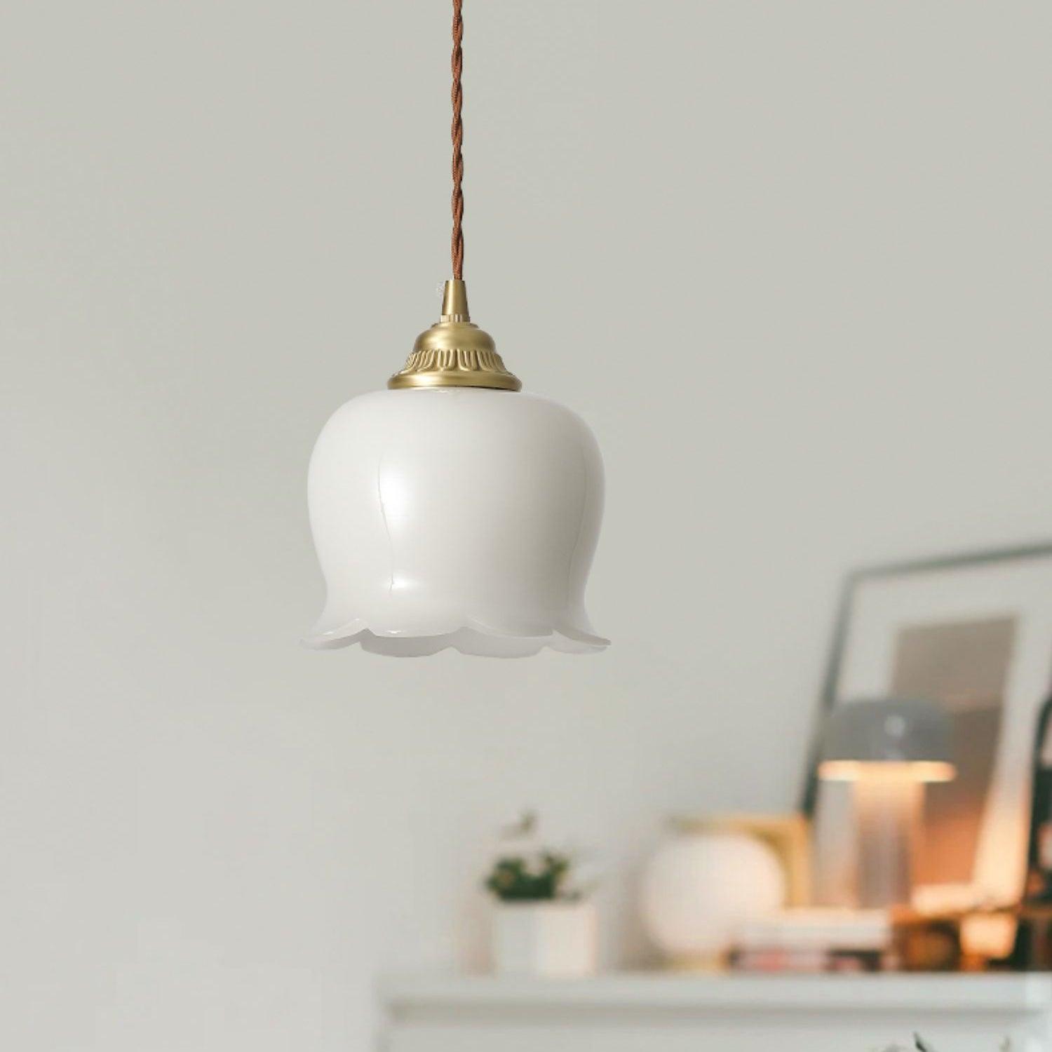 Brass petal pendant light suspended from a slim cord