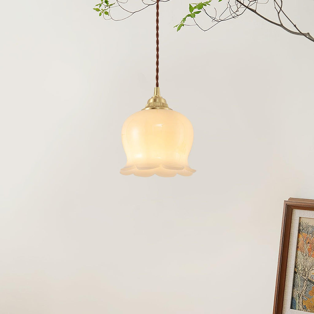 Brass pendant light with petal shade shown in detail