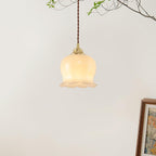 Brass pendant light with petal shade shown in detail