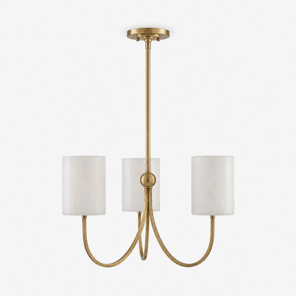Studio shot of this Clérachic chandelier in brass finish, its three alabaster cylinder shades on curved arms, against white.