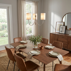 Near a curtained window, this Clérachic chandelier in brass finish hangs above a walnut dining table set for a meal.