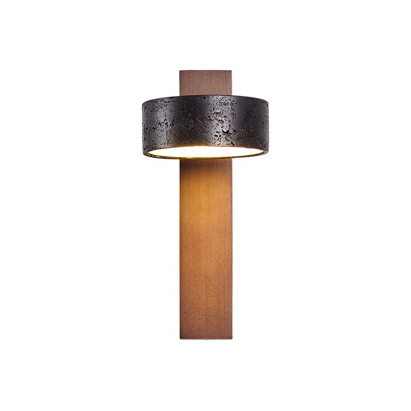 Straight-on product shot of this Clérachic wall light, the walnut bar rising to a black travertine drum shade.