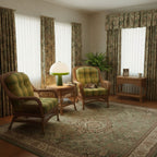 In a cosy sitting room, the Clérachic dome table lamp glows on a side table flanked by two wicker armchairs with plaid cushions.