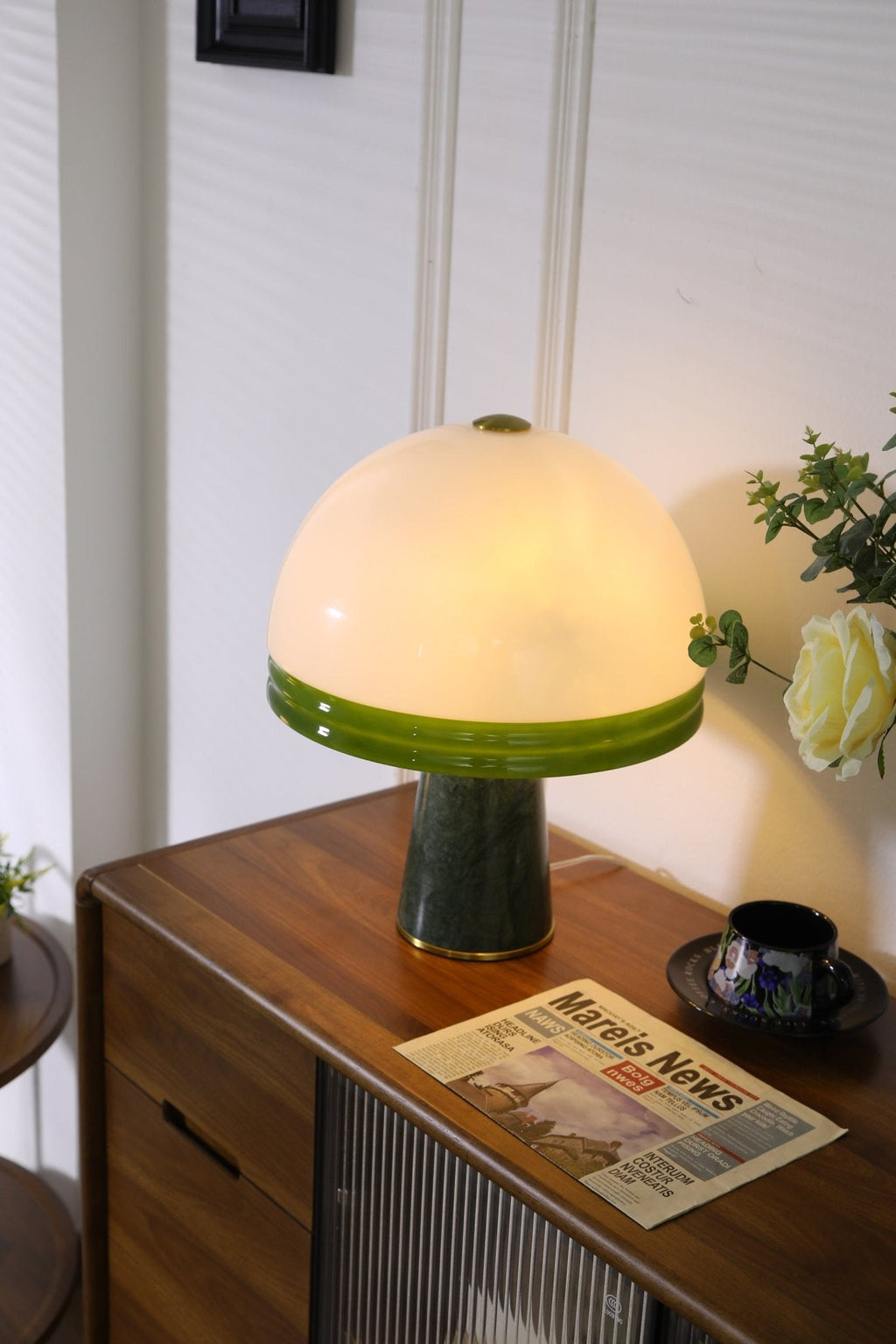 This crop moves the cream rose closer to the shade, with the Clérachic dome table lamp glowing on the cabinet.