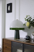 Clérachic dome table lamp shown unlit with extra headroom above the shade and a small framed picture on the wall.