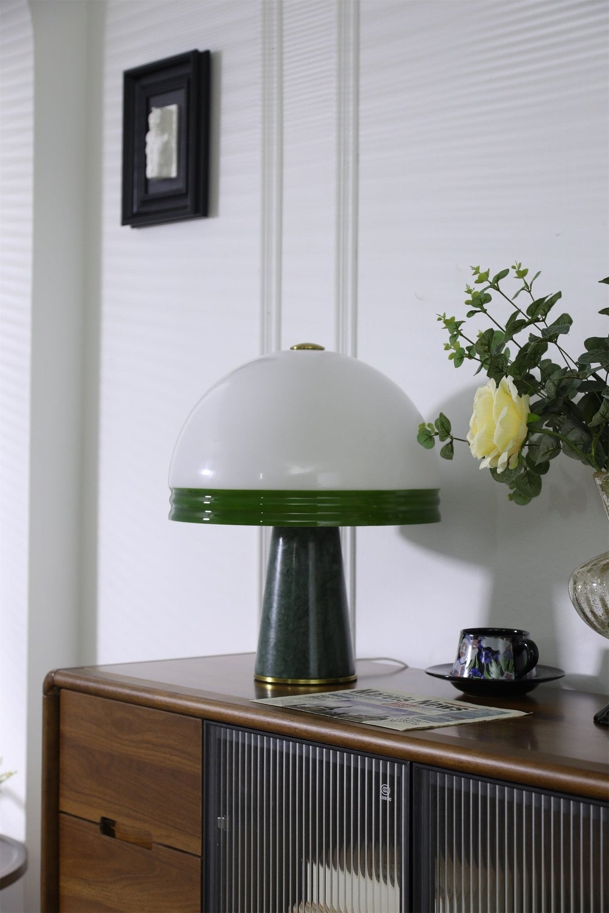 Clérachic dome table lamp shown unlit with extra headroom above the shade and a small framed picture on the wall.