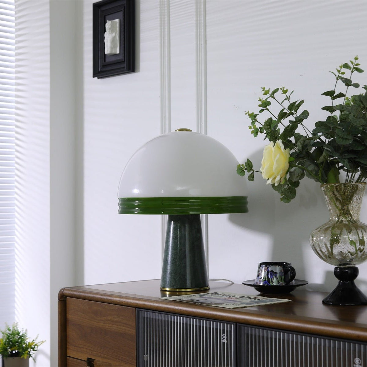 Clérachic dome table lamp shown unlit on the cabinet, photographed straight-on with the rose positioned to its right.
