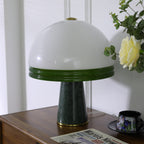 Extreme close-up of the unlit Clérachic dome table lamp's shade, cropped so the marble base is barely visible.