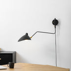 Versatile arm wall sconce lighting a textured accent wall
