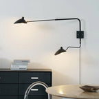 Adjustable arm wall sconce lighting a corner with warm light
