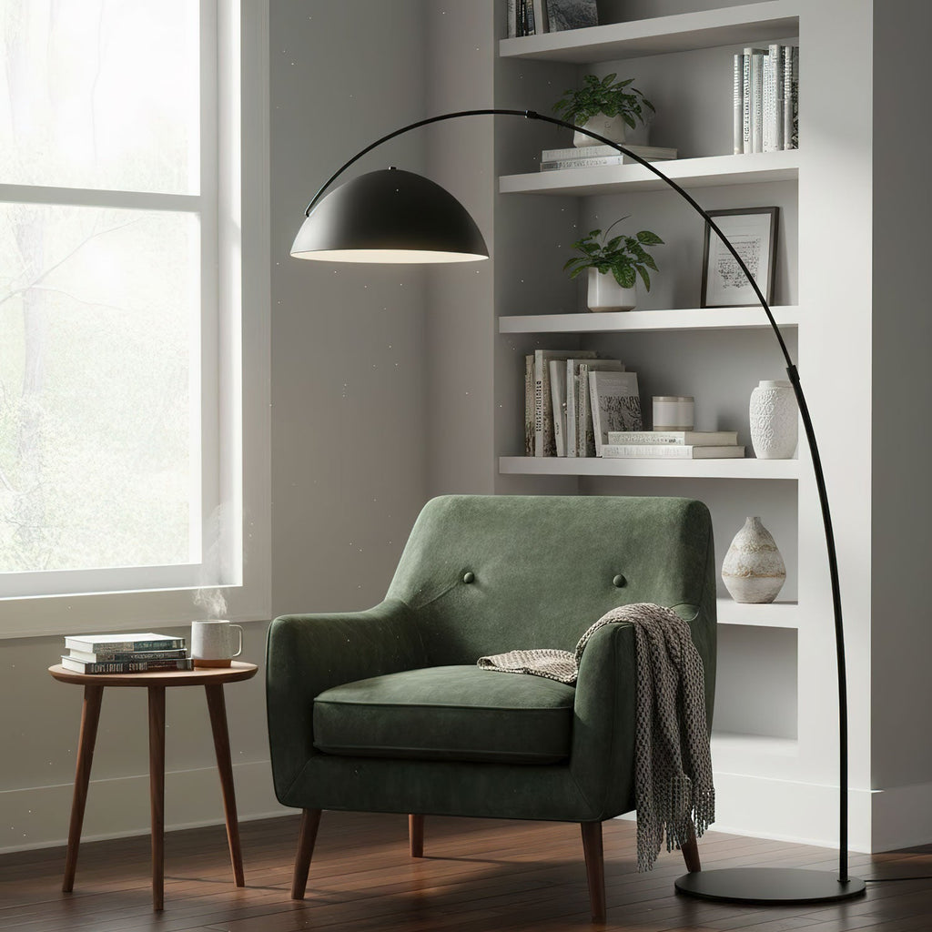 Verse arc floor lamp beside a bed in a soft-lit bedroom