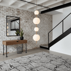 Globe pendant light finish options in brass and black