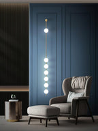 Wall lamp with stacked glowing balls shown in an interior setting