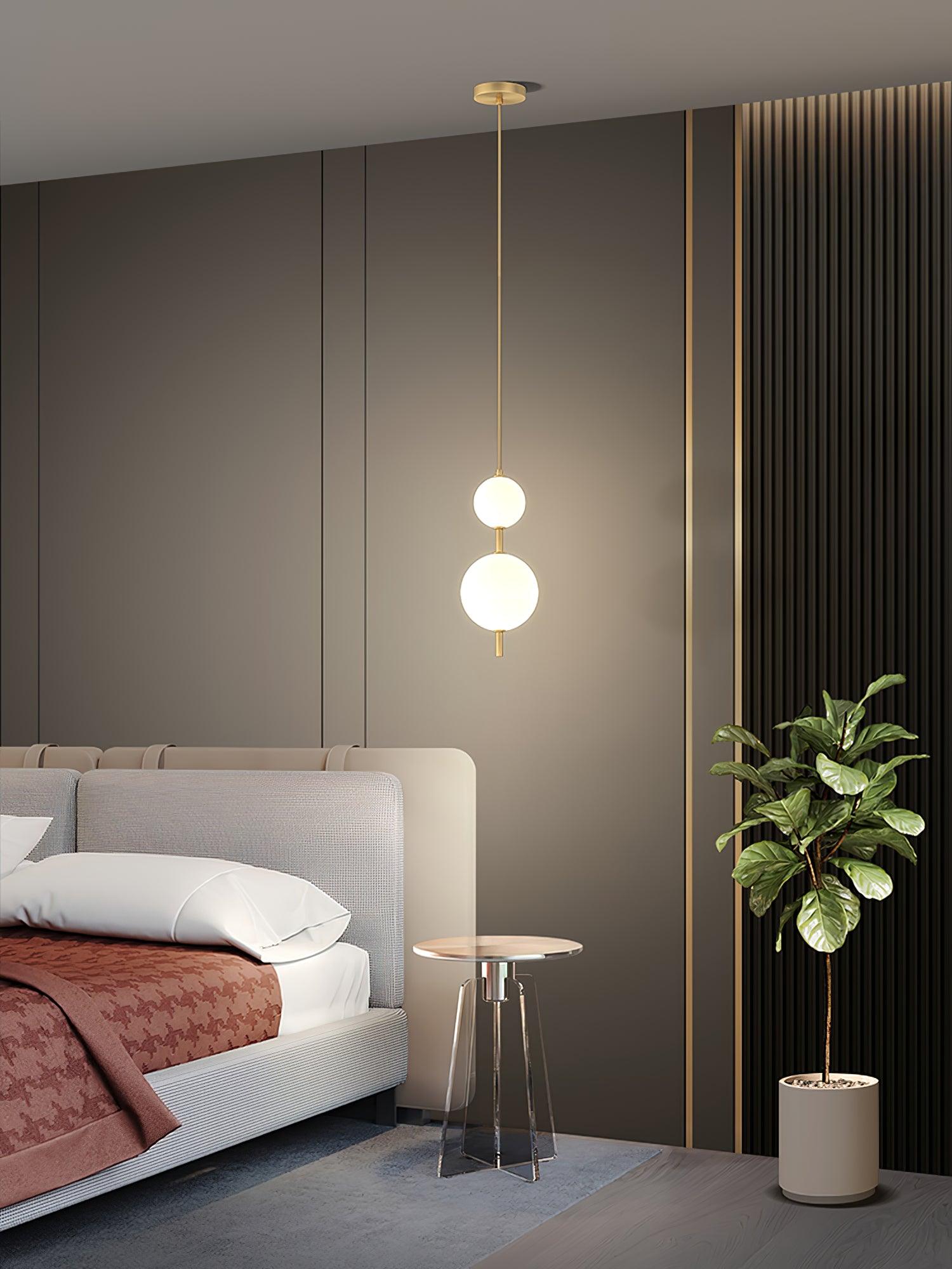 Glass globe pendant light reflecting warm light