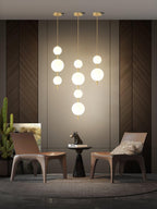 Glass globe pendant light close up with warm filament tone
