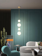 Glass globe pendant light glowing in a dim room