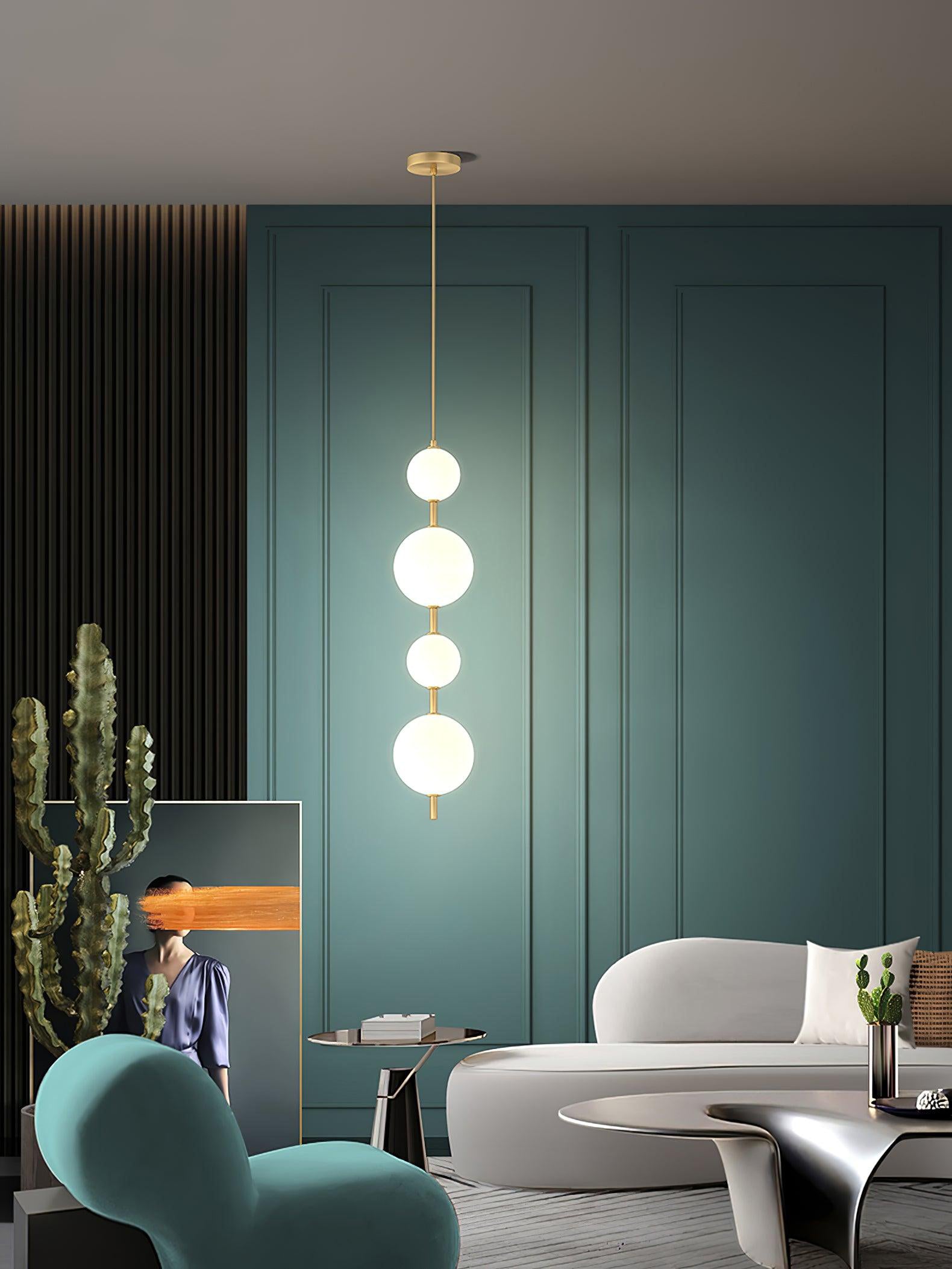 Glass globe pendant light glowing in a dim room
