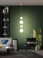 Glass globe pendant light lit above a counter