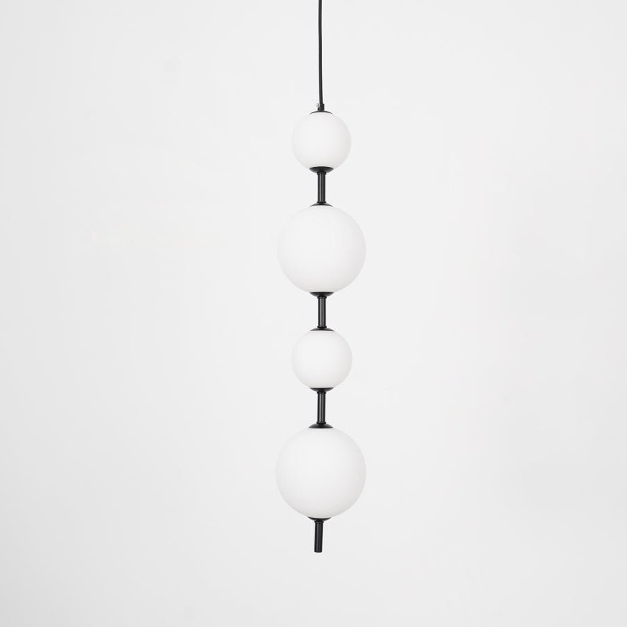 Brass globe pendant light close up showing the ball shade
