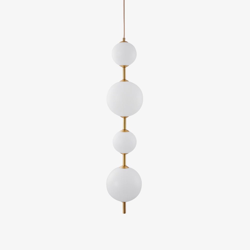 Cluster of globe pendant lights at varied lengths