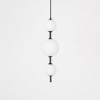 Globe pendant light with black finish and round shade