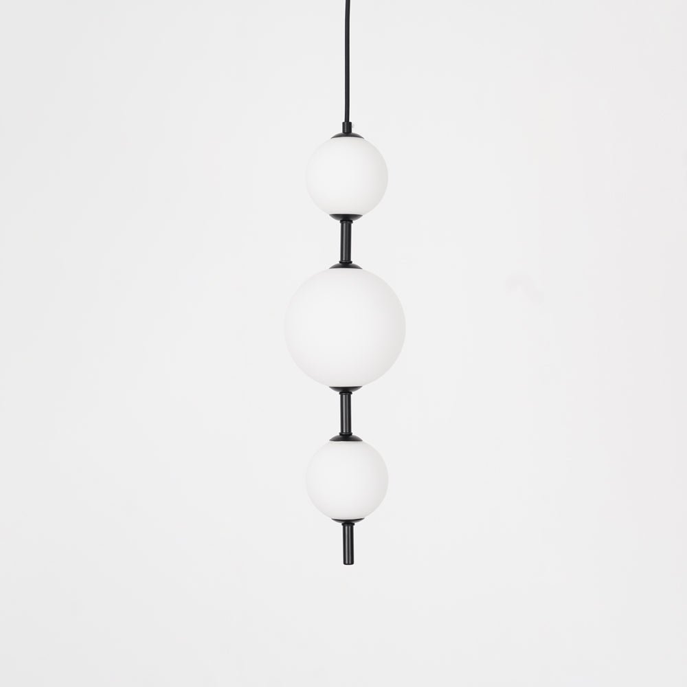 Globe pendant light with black finish and round shade