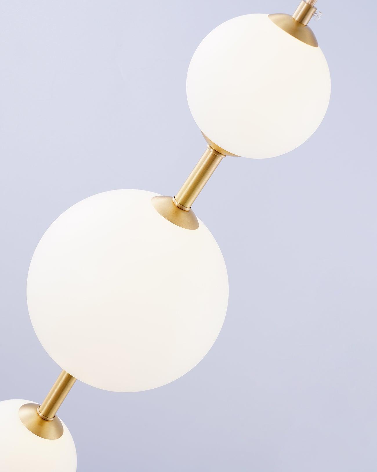 Vertical globe pendant light with warm glow in evening
