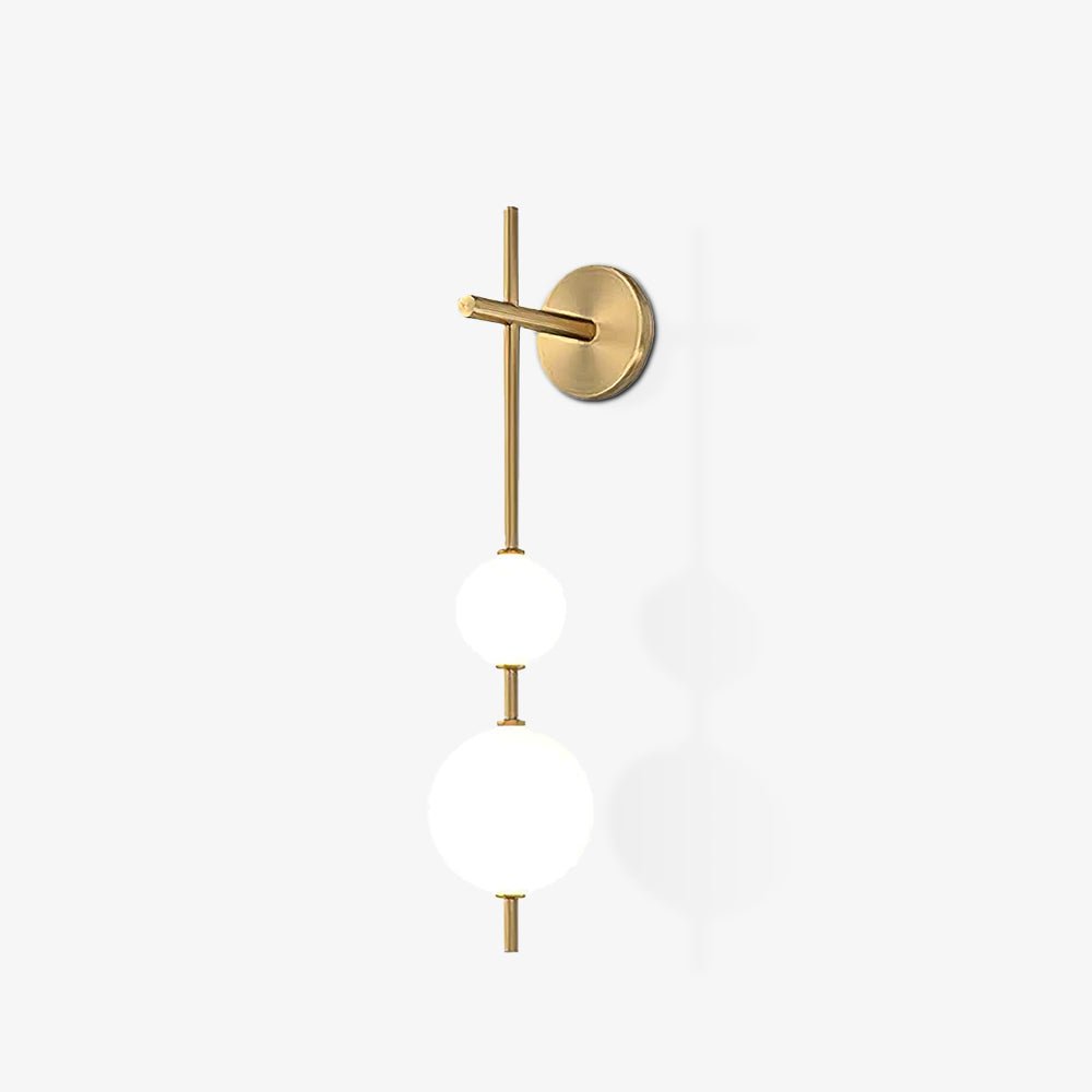 Vertical glass globe wall lamp shown mounted on a wall