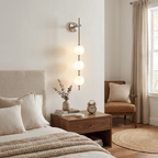 Vertical globe wall lamp shown against a plain white background