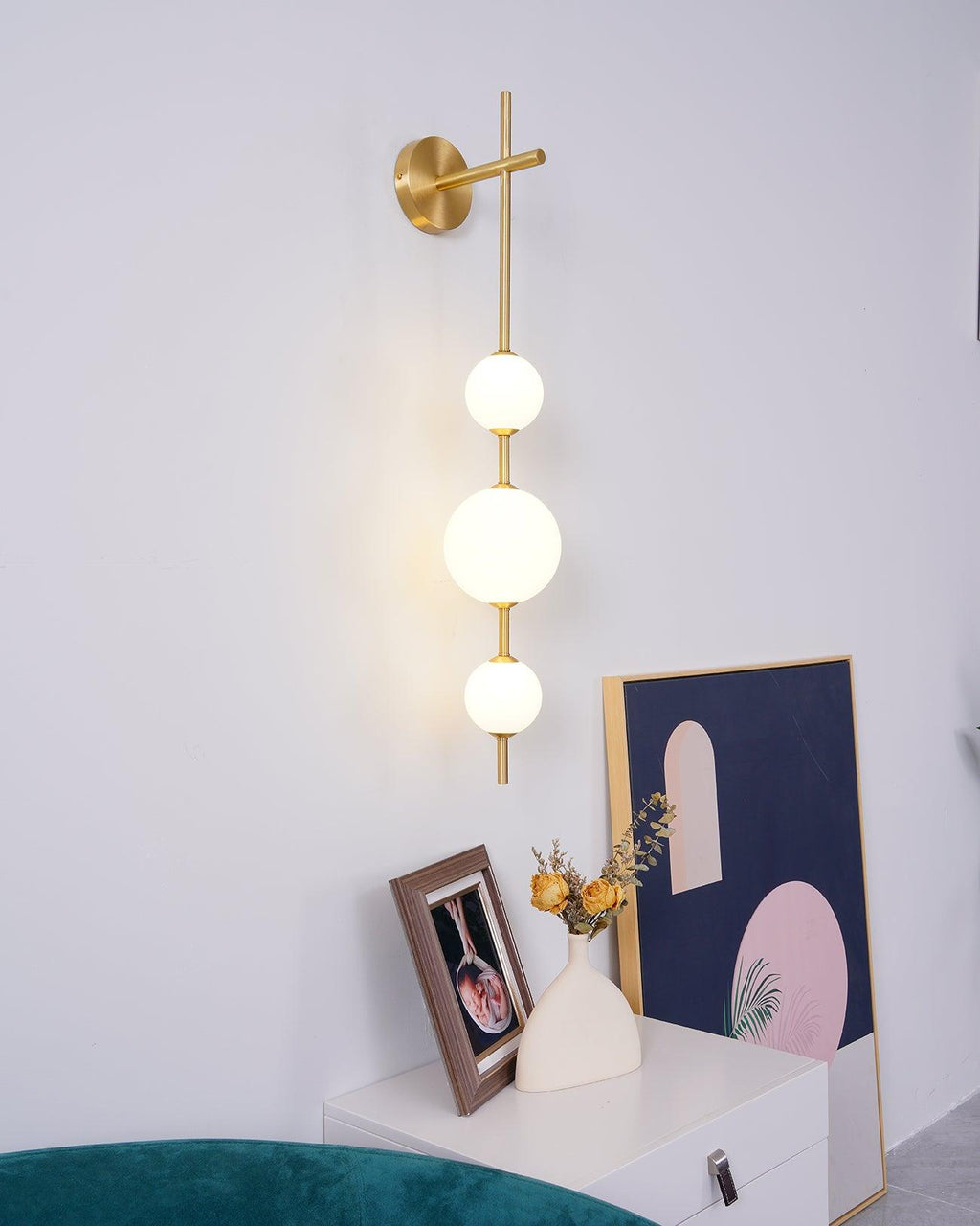 Glass globe wall lamp illuminating a calm bedroom corner