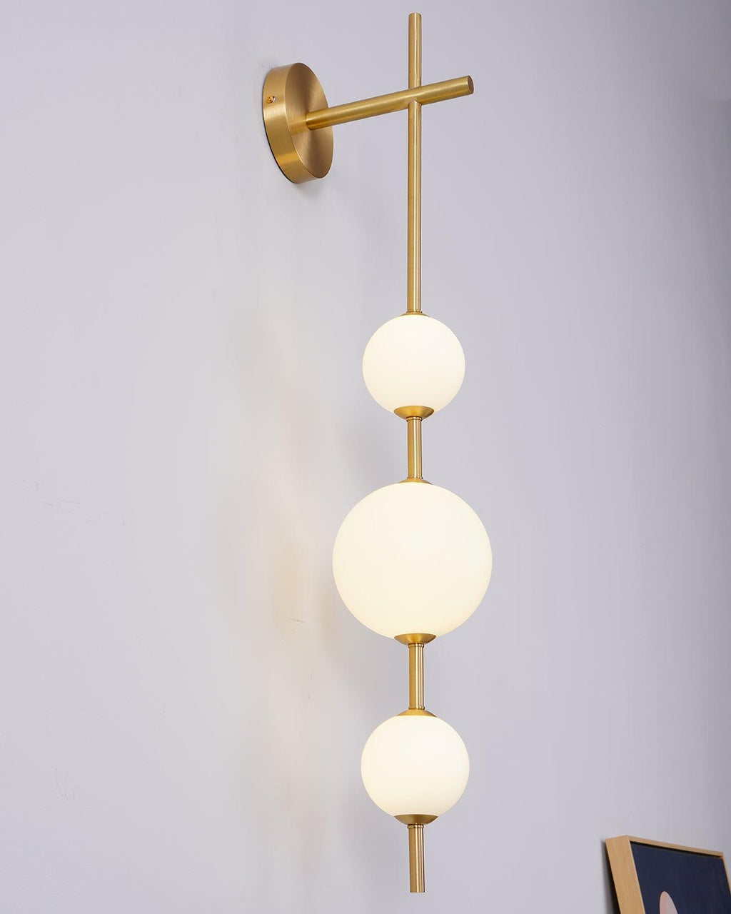 Glass globe wall lamp adding warm light to a quiet room