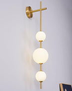 Glass globe wall lamp adding warm light to a quiet room