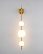 Glass globe wall lamp casting a soft glow in a cozy setting