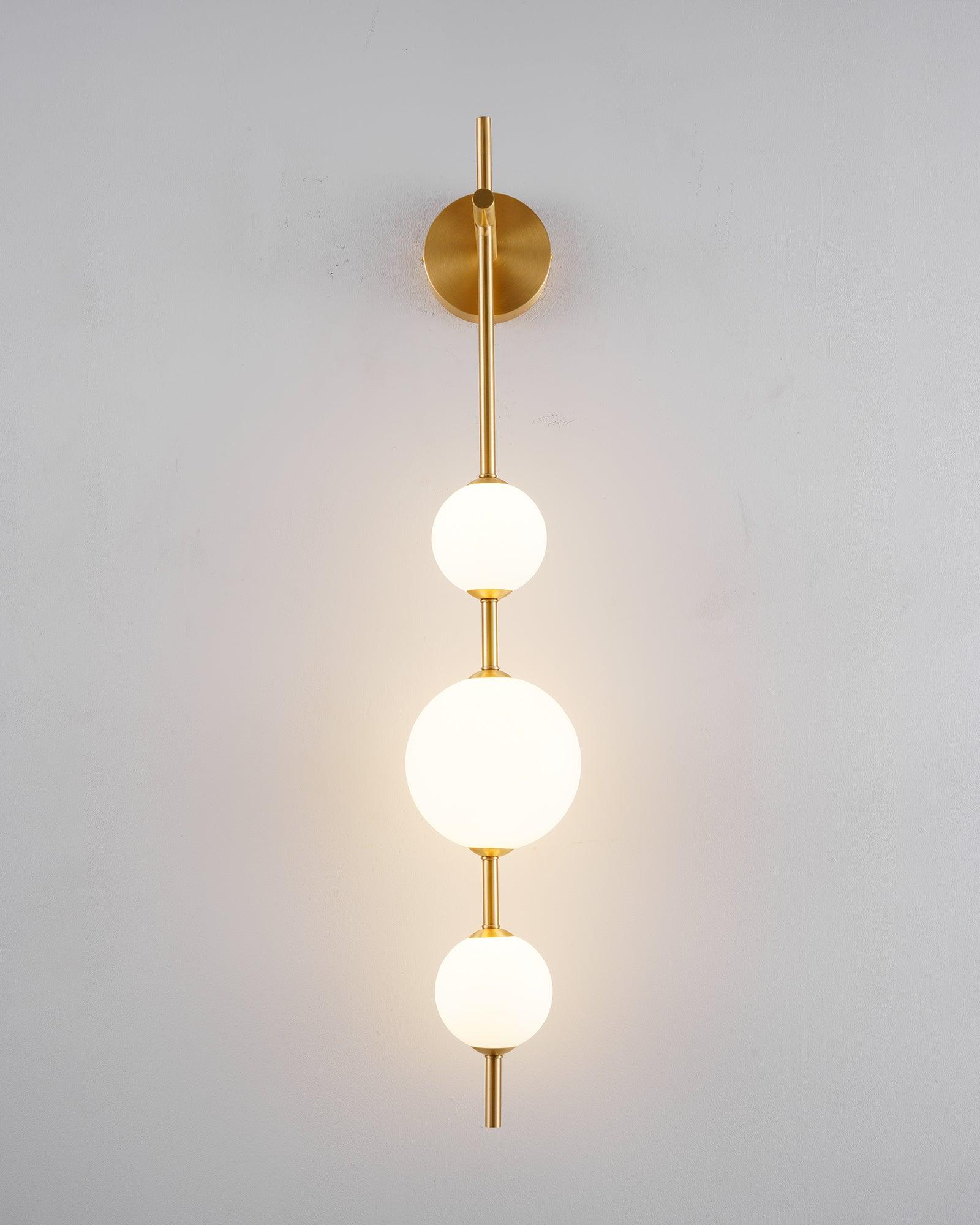 Glass globe wall lamp casting a soft glow in a cozy setting