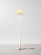 Clérachic floor lamp on white background, shown at a slight angle with its cord trailing across the floor.